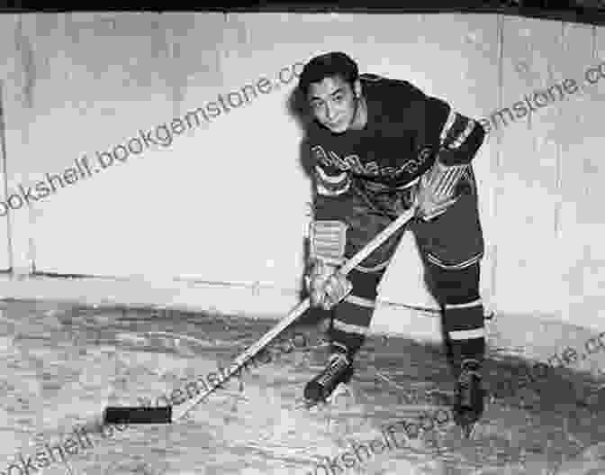 A Black And White Photograph Of Larry Kwong, The First Chinese Canadian Player In The NHL, Wearing A New York Rangers Jersey And Holding A Hockey Stick. King Kwong: Larry Kwong The China Clipper Who Broke The NHL Colour Barrier