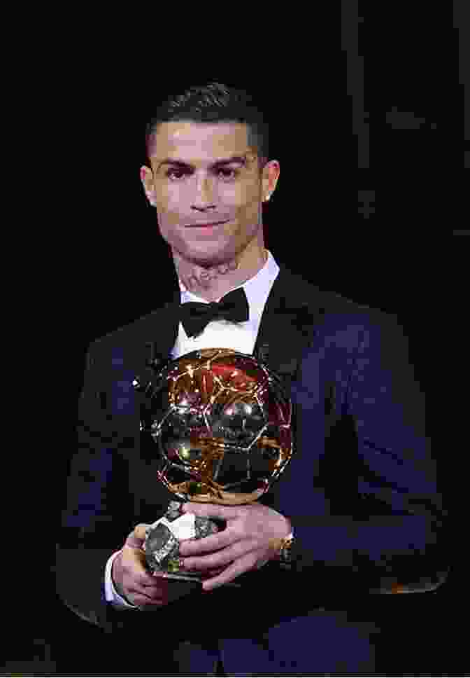 Cristiano Ronaldo Holding The Ballon D'Or After Winning It With Real Madrid Eden Hazard: The Inspirational Story Of The World S Most Dynamic Forward