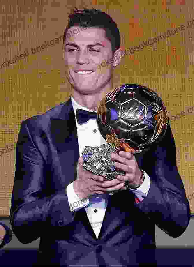 Cristiano Ronaldo Holding The Ballon D'Or Award Eden Hazard: The Inspirational Story Of The World S Most Dynamic Forward